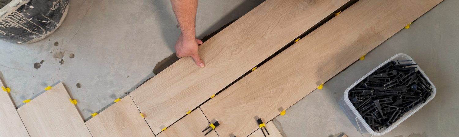 top-view-man-tiling-floor